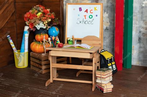 Premium Photo | Empty classroom with blackboard and wooden table. kindergarten.