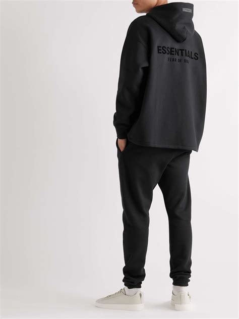 Black Logo-Flocked Cotton-Blend Jersey Hoodie | FEAR OF GOD ESSENTIALS ...