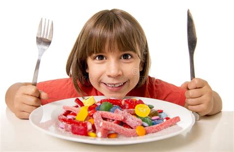 Child Eating Candy Like Crazy In Sugar Abuse And Unhealthy Sweet Nutrition Concept Stock Photo ...