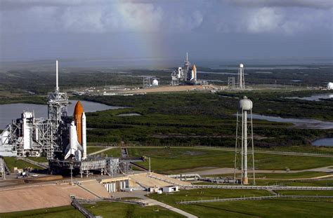 Two shuttles, Atlantis (foreground, STS-125), and Endeavour (background, STS-400) on launch pads ...