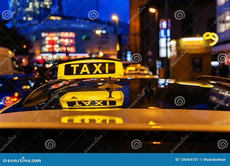 Taxi Sign on the Roof of a Taxi at Night Stock Image - Image of travel, darkness: 136404101