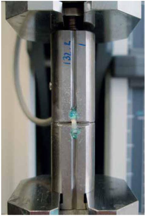 Fig. (3). The ends of a test specimen attached for tensile bond ...