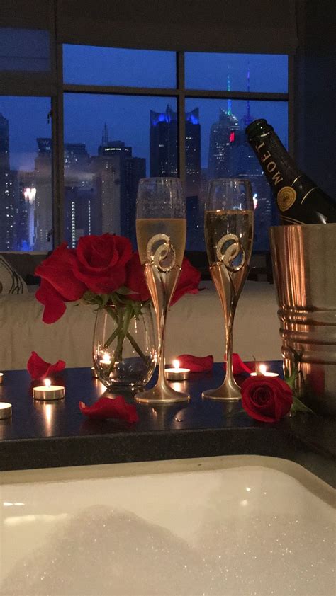 Anniversary celebration in NYC. Bubbly and bubble bath overlooking the ...