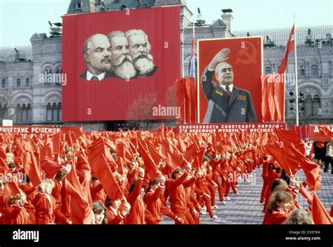 MOSCOW, USSR. MAY 1, 1980. People dressed in red, with red flags in ...