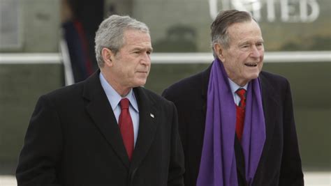 Bush 41 defends Bush 43 in updated book