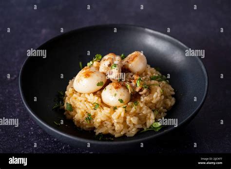 Cuttlefish risotto with garlic butter Stock Photo - Alamy