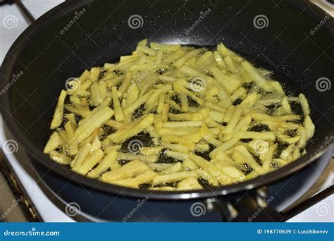 Frying French Fries in Sunflower Oil in a Frying Pan Stock Image ...