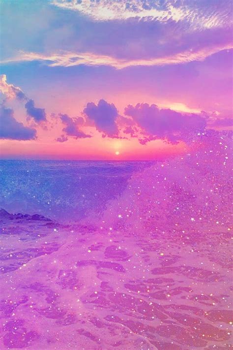 Download Pink Beach Sunset With Shimmering Waves Wallpaper | Wallpapers.com