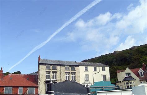 Airplane Vapour Trails In Blue Sky Line Scarborough Rooftops Photo ...