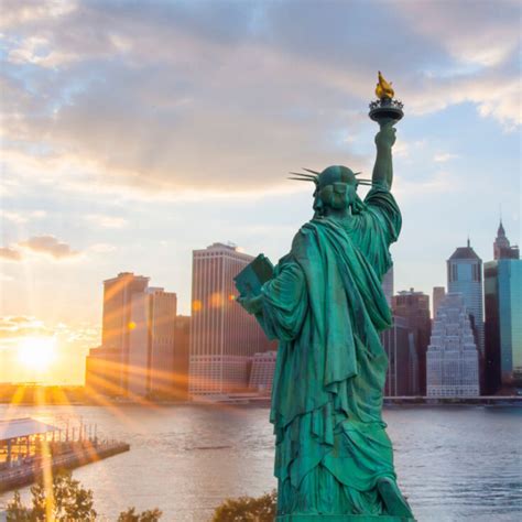 statue of liberty at sunset - Travel Off Path