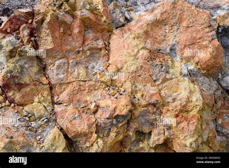 Ignimbrite volcanic rock formation. The yellow veins are jarosite mineral and reddish are ...