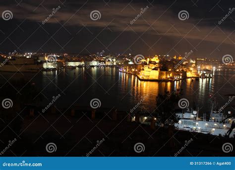 Valletta harbor at night editorial photo. Image of water - 31317266