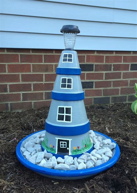 Terra cotta pots n solar light makes a cute lighthouse | Clay pot lighthouse, Terra cotta pot ...