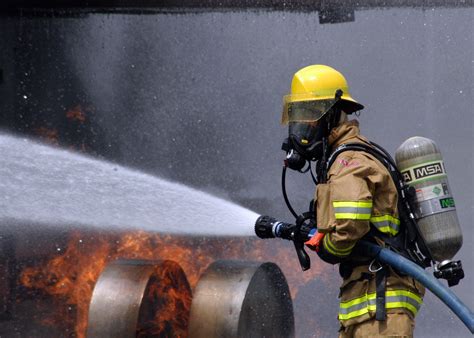 File:US Navy 080730-N-5277R-003 A Commander, Naval Forces Japan firefighter douses a fire on a ...