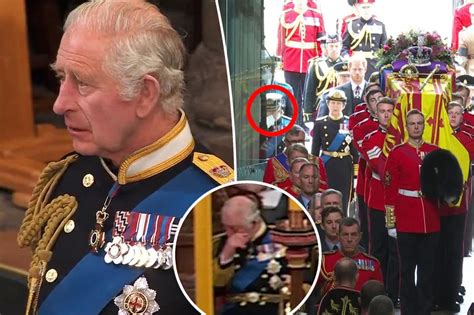 King Charles III wipes away tears at Queen Elizabeth II's funeral