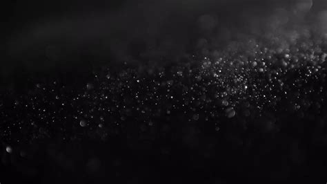 Dust Swirling On A Black Background - Stock Video | Motion Array