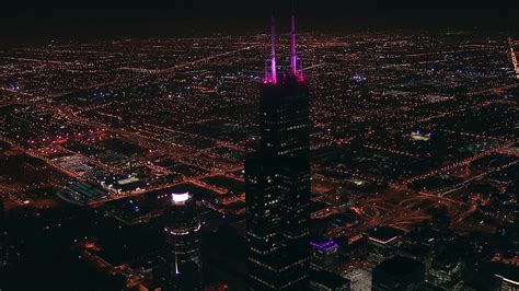 HD stock footage aerial video approach the top of iconic Willis Tower skyscraper at night ...