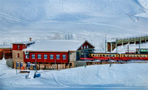 Yellow and Red Train Beside Snowy Mountain · Free Stock Photo