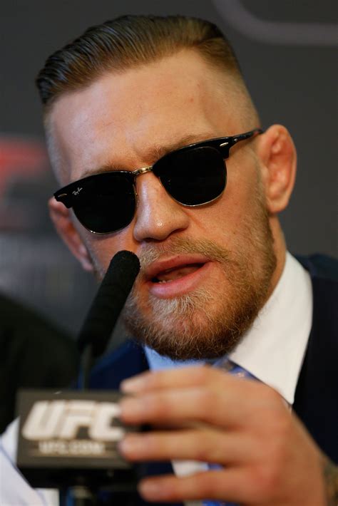 DUBLIN, IRELAND - JULY 16: Conor McGregor of Ireland interacts with media at a press conference ...