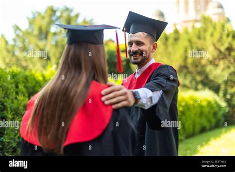 Beautiful graduate girl and boy enjoyed the ceremony graduation Stock Photo - Alamy