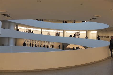 The Guggenheim Museum on the Inside. A spiral-ramped building topped by ...