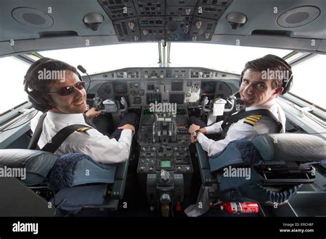 pilots in the cockpit of the KBX, Fokker 70 of the Dutch Government Stock Photo - Alamy