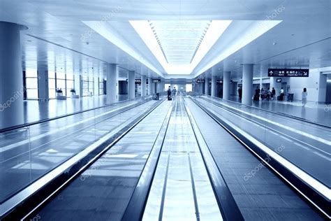 Escalator in airport Stock Photo by ©zhudifeng 29880439