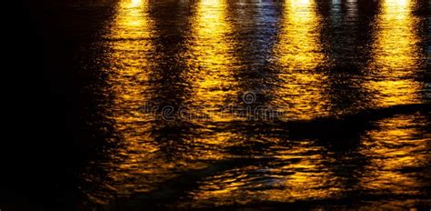 The Reflection of Light on Water at Night. Stock Image - Image of ...