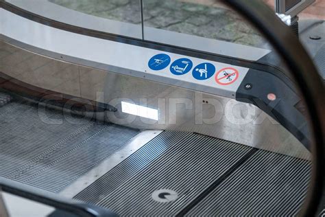 photo of escalator with warning signs | Stock image | Colourbox