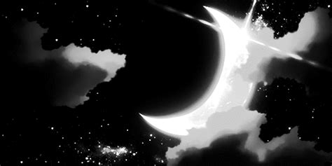 a black and white photo of the moon in the night sky with clouds around it