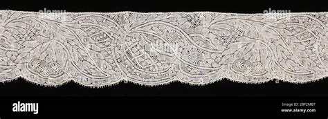 Border. Binche lace worked with conventionalized floral design and ...