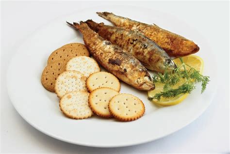 Sardines with Crackers and Garnish on White Plate - Prepared Food ...