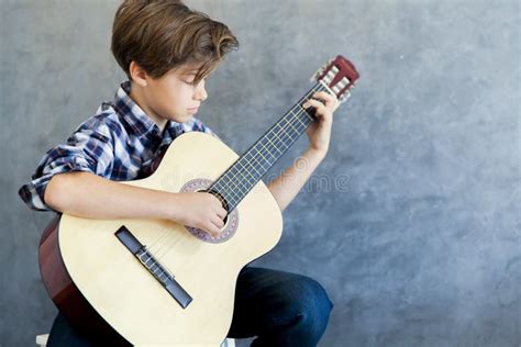 Teen Boy Playing Acoustic Guitar Stock Image - Image of handsome ...