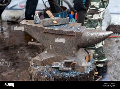 Old anvil with blacksmith tools on the outdoors Stock Photo - Alamy