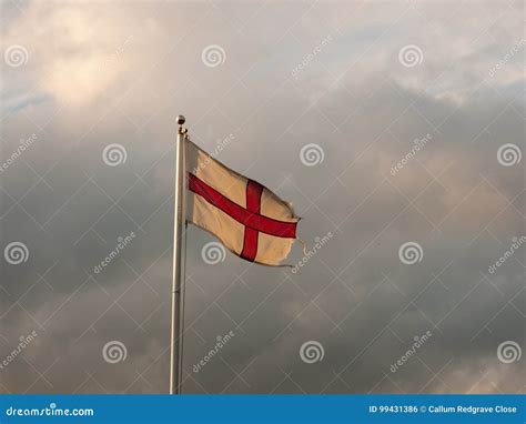 England Flag Flying with Cloudy Dramatic Skies during Sunset Stock ...