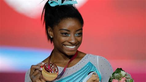 Simone Biles makes history as 1st woman to win 4 all-around world ...