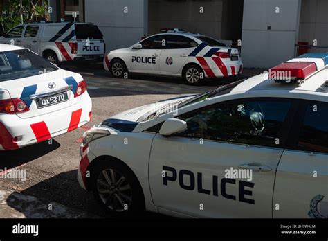 "27.10.2021, Singapore, , Singapore - Police patrol cars park in front ...