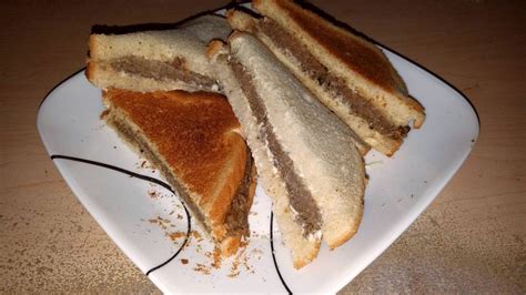 Two livermush sandwiches, with mayo, on white bread. : eatsandwiches