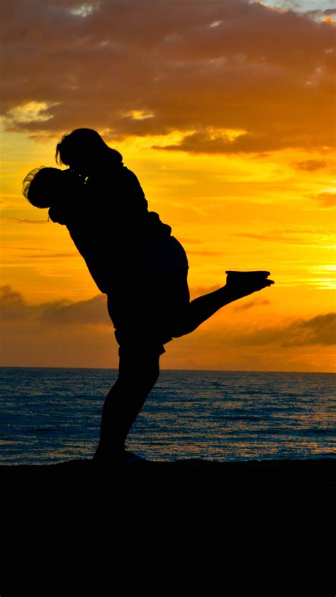 Couple Romantic Kiss Sea Sunset Silhouette 4K Ultra HD Mobile Wallpaper