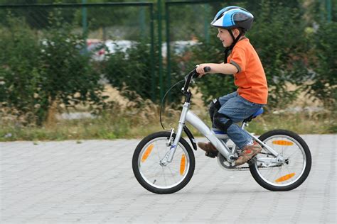 boy riding bike in a helmet | Tricia Lott Williford