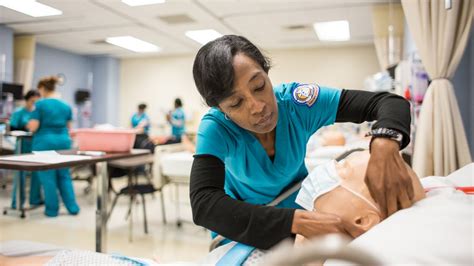 Students studying in ACC's accelerated nursing program practice medical skills