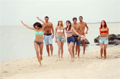 Premium Photo | Beautiful young people having fun on beach