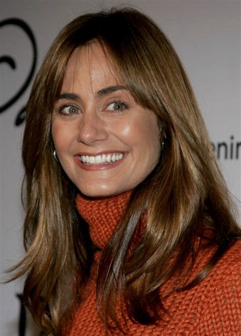 Diane Farr | Natural looking hairstyle with side bangs for long brown hair