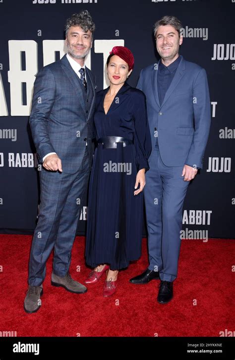 Taika Waititi, Chelsea Winstanley and Carthew Neal arriving at Fox Searchlight's JoJo Rabbit ...