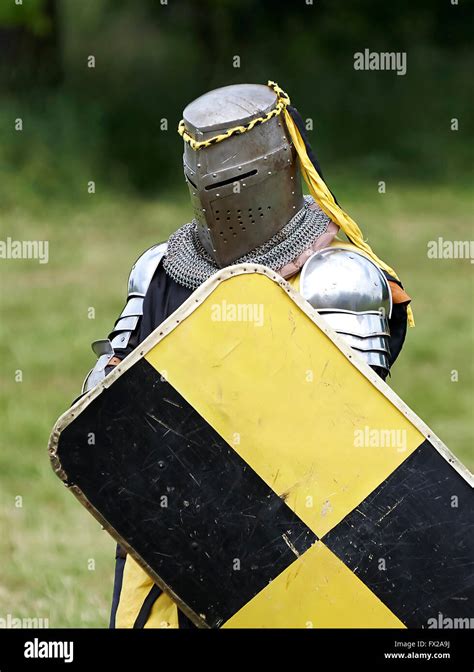 Medieval knight with shield on the battlefield Stock Photo - Alamy