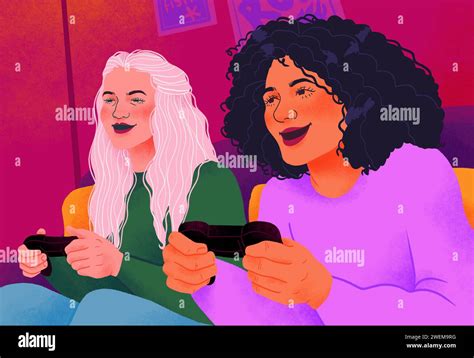 Happy young women friends playing video game together Stock Photo - Alamy
