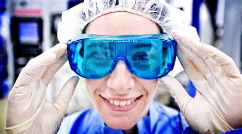 Scientist wearing protective goggles - Stock Image - C024/7214 ...