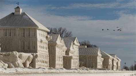 Winter Wonderland| Homes and piers covered in ice after winter storm in ...