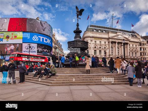 Piccadilly Circus, London, England, with the statue of Eros, crowds of ...