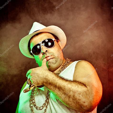 italian funny mafia boss rapper with undershirt and sunglasses on smoky ...